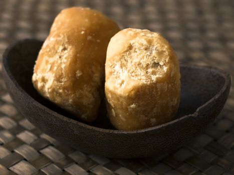 close up of a bowl of jaggery balls