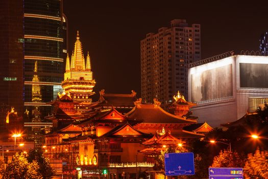 Golden Temples Roof Top Jing An Tranquility TempleCentral Shanghai, China. Richest buddhist temple in Shanghai at Night.  