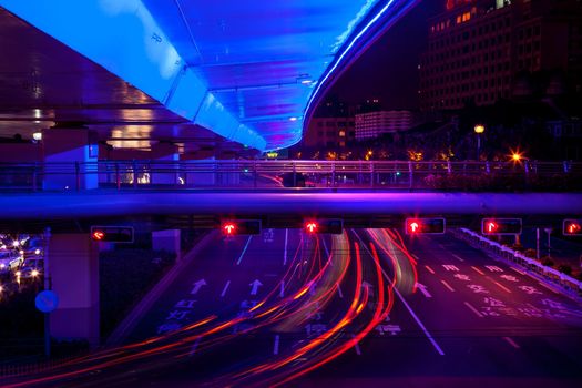 Blue Highway Street Traffic Cars and Light Trails at Night in Central Shanghai, China.