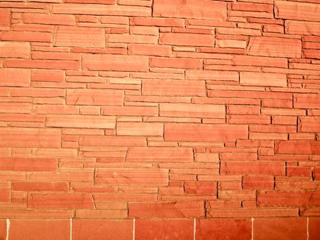 Modern stone wall of orange block