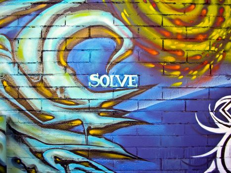 Urban wall art with message of Solve