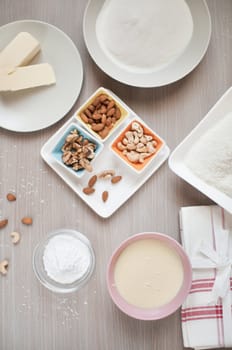 Baking ingredients for sweets: nuts, flour, butter, sugar, milk