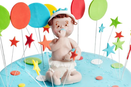 Studio shot of blue birthday cake on light background