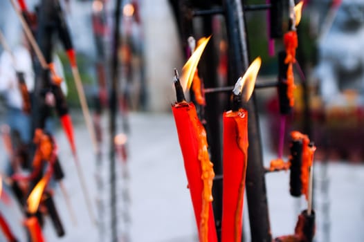 Burning incense candles in Chinese buddhist temple