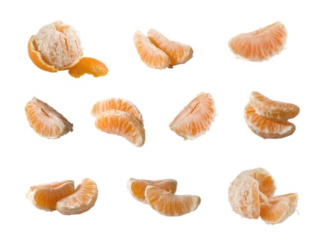 Some isolated pieces of the tangerine on the white background