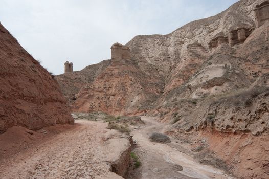 Road on the foot of hills in Chinese rural area