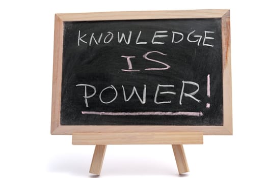 "Knowledge is power" text written on blackboard over white background