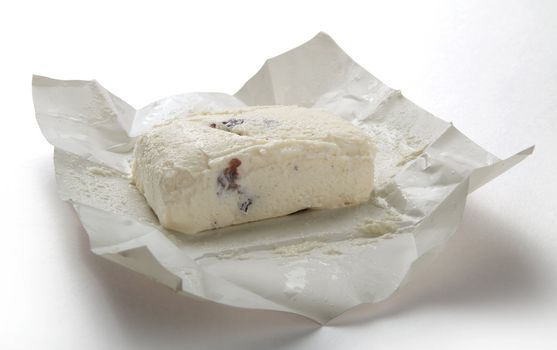 Brick of cottage cheese with risins in the white package