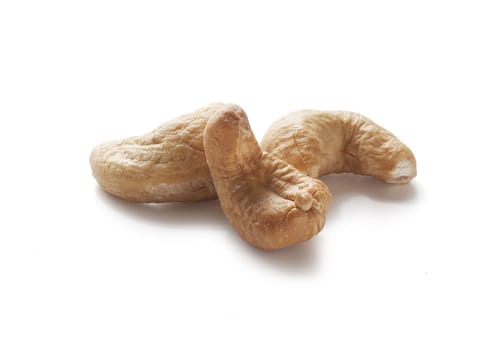 Three isolated cashew nut on the white background