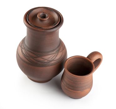 Isolated clay jug and mug on the white background