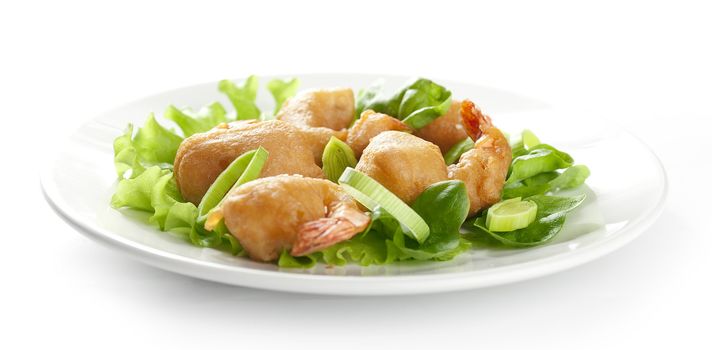 Shrimp tempura with lettuce, leek and sesame on the white palate