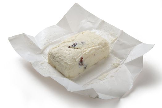 Brick of cottage cheese with risins in the white package