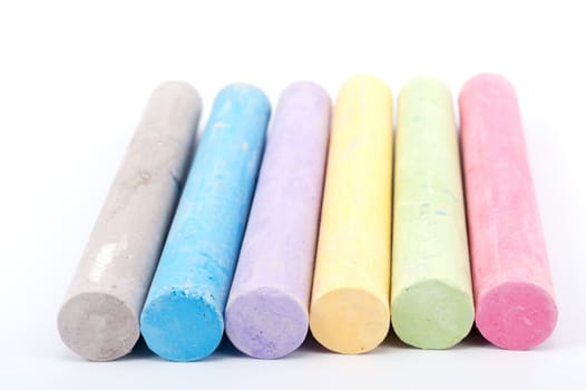 Group of colorful chalks on white background