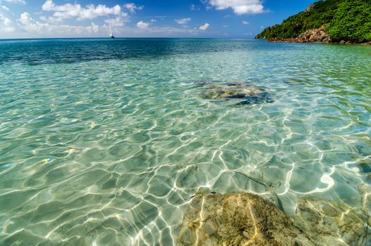 Sun reflectiing in crystal clear water in San Andres y Providencia, Colombia