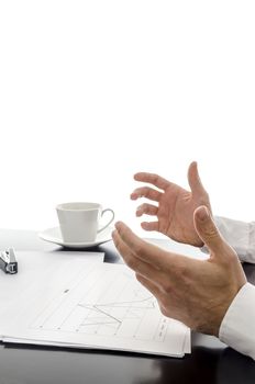 Businessman explaining strategy with financial documents in front of him.