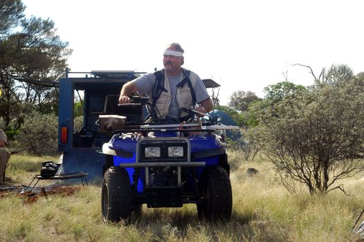 Gold bearing prospection in the Australian bush in quad to have a larger research area and to find the most beautiful gold nuggets.