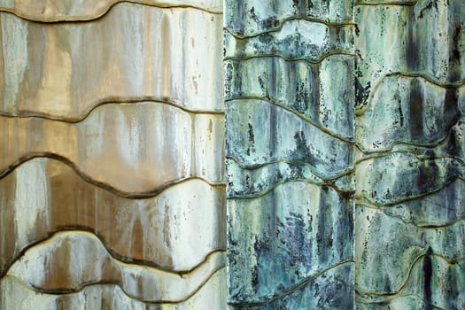 Concrete white, tan, blue, and green weathered Abstract flowing wall