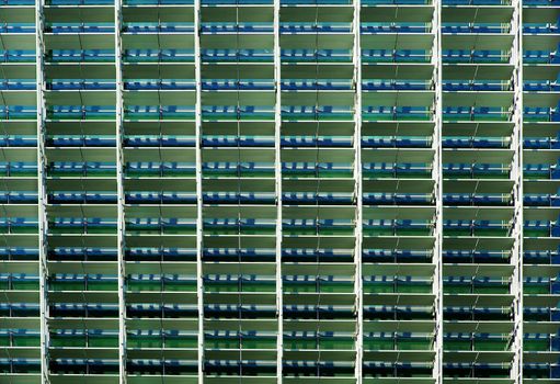 Busy view of a office building solar shade arrangement
