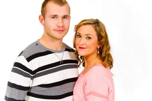 An attractive couple against a white background in the studio to create this isolated portrait.