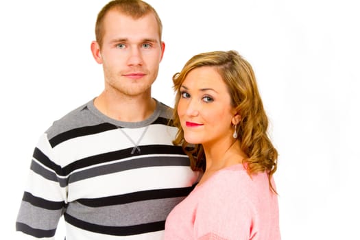 An attractive couple against a white background in the studio to create this isolated portrait.