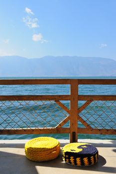 Two cushions by the lake