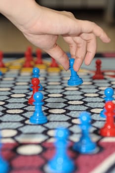 Hand moving piece in the Chinese checker game