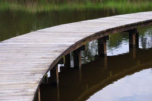 Wooden bridge in the wetland park