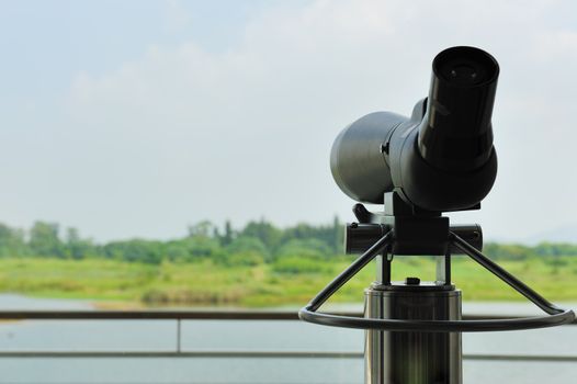 Telescope for bird-watching in the wetland park