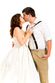 An attractive woman and her handsome husband wear their wedding attire in the studio agains an isolated white background.