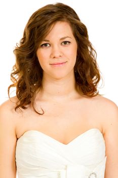 A beautiful and young bride in her white wedding dress in a studio against an isolated white background.