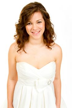 A beautiful and young bride in her white wedding dress in a studio against an isolated white background.