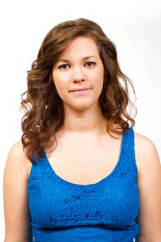 An attractive girl in a blue shirt against an isolated white backgtround in the studio.