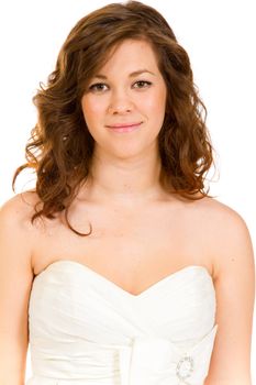 A beautiful and young bride in her white wedding dress in a studio against an isolated white background.