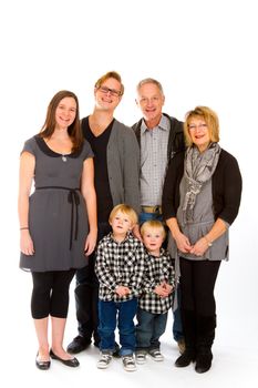 This group of six people includes three generations on an isolated white background in the studio.