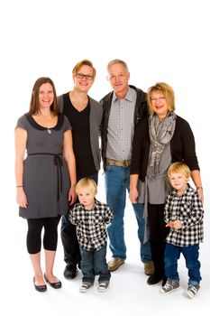 This group of six people includes three generations on an isolated white background in the studio.