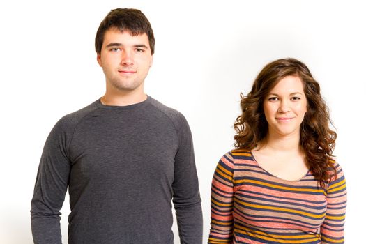 A man and a woman in a studio against an isolated white background for this simple portrait.