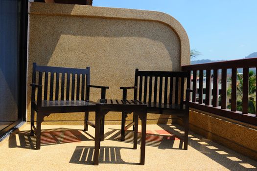 Table and chairs on the sunny balcony