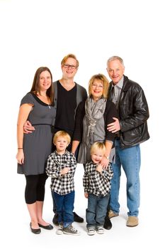 This group of six people includes three generations on an isolated white background in the studio.