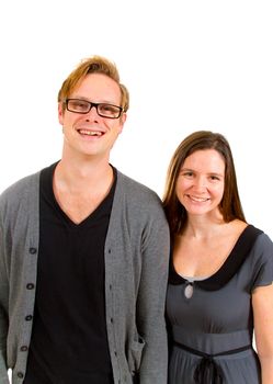 A man and woman pose for this family portrait in the studio against an isolated white background.