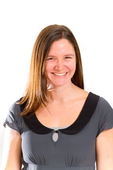 A pretty woman poses for a portrait in the studio against an isolated white background while wearing black and grey and looking happy.