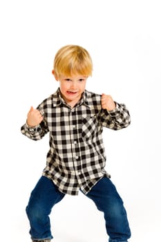 A young boy in a plaid shirt poses for this portrait in the studio against an isolated white background.