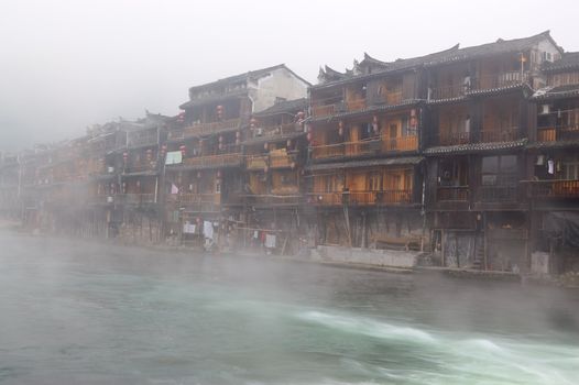 China river landscape with traditional buildings in Fenghuang county, Hunan province