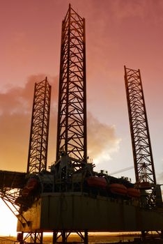 Oil rig in thew harbour of Esbjerg, Denmark at sunset.