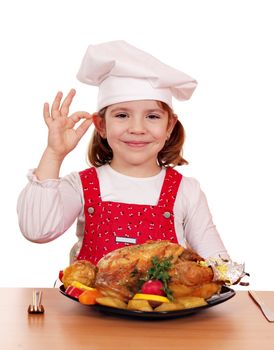 beautiful little girl cook with grilled chicken