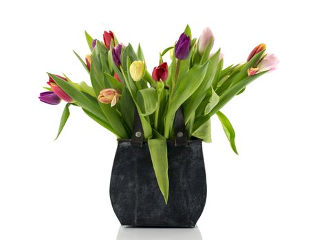 bouquet of tulips in metal shopping bag