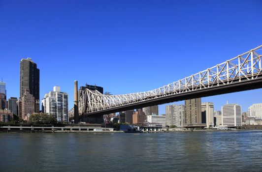 Queensboro Bridge Spanning the East River in New York City on a sunny day
