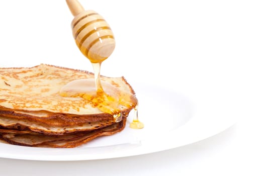 Delicious Freshly Prepared Pancakes with Honey on white