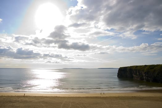 Beautiful bright sun over the Ballybunion beach and cliffs in Ireland on a summers day