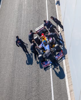 JEREZ DE LA FRONTERA, SPAIN - FEB 10: Sebastian Vettel of Red Bull F1 entering to the pit on training session on February 10 , 2012, in Jerez de la Frontera , Spain
