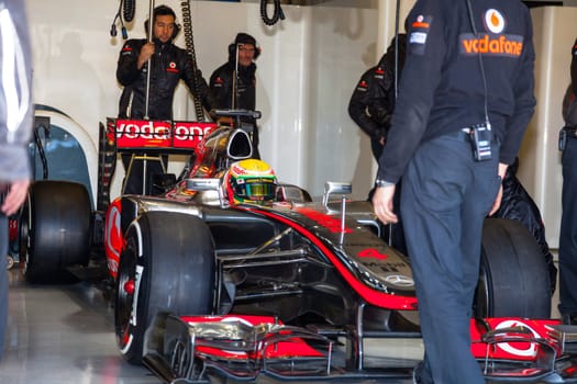 JEREZ DE LA FRONTERA, SPAIN - FEB 10: Lewis Hamilton of McLaren F1 waiting on the pit on training session on February 10 , 2012, in Jerez de la Frontera , Spain